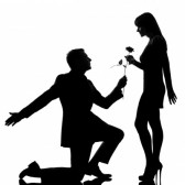 12896603 One caucasian lovers couple Man kneeling offering rose flower And woman In studio silhouette isolate
