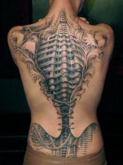 tattoo On back The alien meets A corset