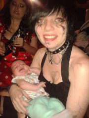 Chelza holding baby... lol wiv evil eyes xD