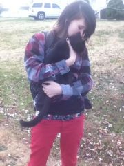 Holding the neighbor cat.