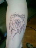 Right thigh AhmandahAnarchy black rose tattoo